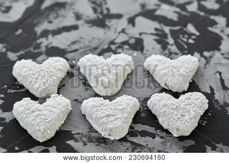 Sweet Crunchy Coconat Heart-shaped Biscuits Arranged In Pattern On Light Textured Background, Top Vi