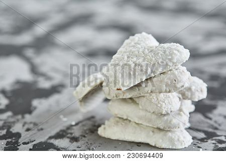 Sweet Crunchy Coconat Heart-shaped Biscuits Arranged In Pattern On Light Textured Background, Top Vi