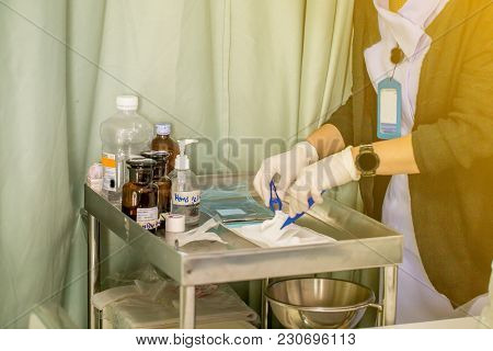 The Nurse With Lots Of Medicine Is Preparing Or Cleaning The Stitch Of Her Woman Patient After Surge