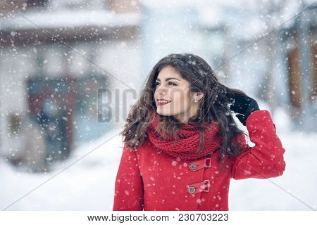Beautiful Brunette Woman Smiling And Rejoices To Snow At Dte City Street. Beautiful Brunette Woman S