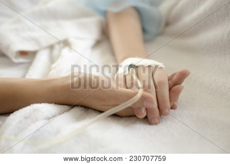 Woman Holding Children Hand In Hospital. Girl Sick In Hospital. People With Medical Concept. Vintage