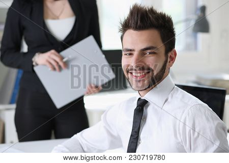 Portrait Of  Handsome Man Work At Office With Assistant
