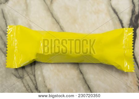Yellow Blank Sealed Plastic Foil Pouch Food Bag Snack Packaging Isolated On White Background Flat To