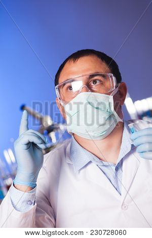 Scientist Is Thinking About Research And Hold Eppendorf Tube