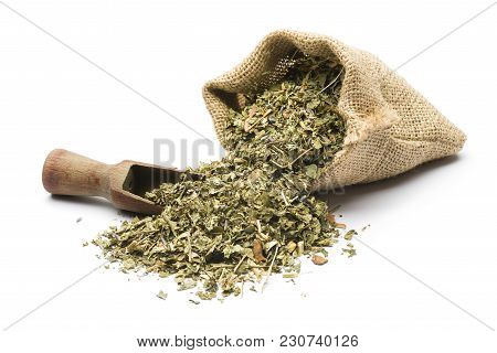 Green Tea Mixture In Juta Bag With Wooden Scoop On White Background
