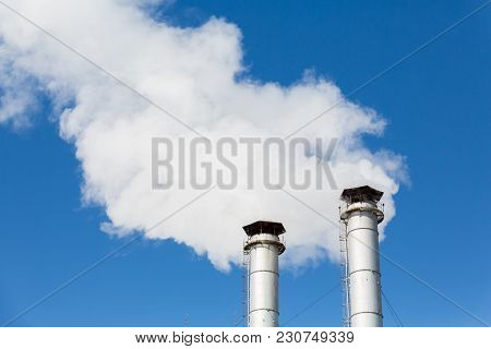 The Smoke From The Chimneys Of The Chp. Pollution Of The Environment. Environmental Disaster. Blue S
