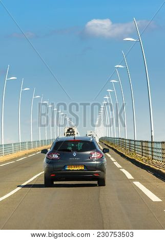 Oleron, France - August 1, 2016 : Rear View Of Black Grey Renault Car Megane Driving On Oleron Bridg