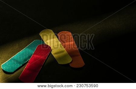First Aid Dressing (plaster) With Non-stick Pad For Quick Wound Healing On Dark Background With Copy