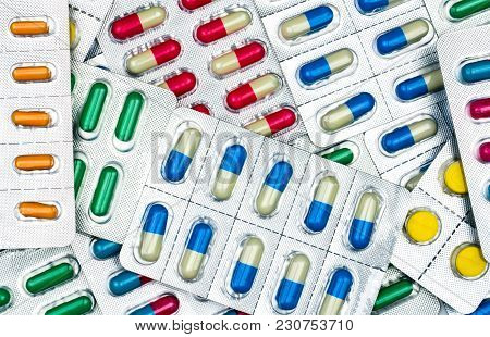Top View Of Colorful Tablets And Capsules Pills In Blister Packs. Global Health Care And Drug Use Wi