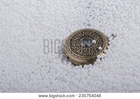 Retro Pocket Watch On White Polystyrene Balls