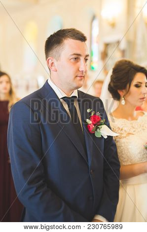 Wedding Couple Bide And Groom Get Married In A Church.