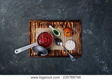 Ukrainian Borsch With Tomato, Beetroot And Brioche. Served On The Rustic Board With A Spoon And Line