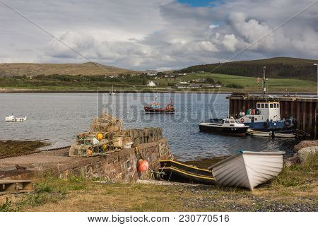 Aultbea, Scotland - June 9, 2012: Harbor Of Aultbea With Pier And A Few Sloops And Fishing Vessels. 