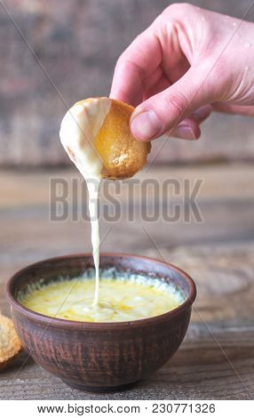 Bowl Of Cheese Dip With Toasts
