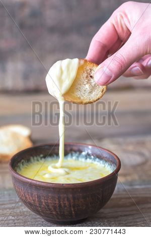 Bowl Of Cheese Dip With Toasts