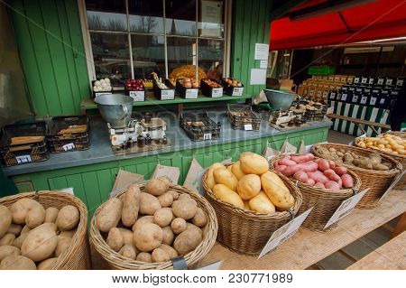 Munich, Germany - November 16, 2017: Stand With Farmers Baskets Full Of Potato And Other Vegetables 