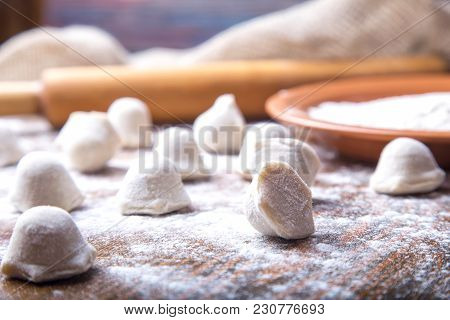 Homemade Pelmeni. Russian Dumplings. Uncooked Pelmeni On The Table