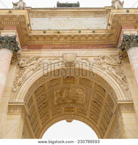 Paris, France - March 28, 2017: The Carrousel Triumphal Arch Arc de Triomphe du Carrousel in front of the Louvre