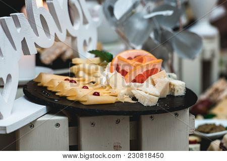 Candybar In A Restaurant. Decorated White Table Fool Of Sweet Pastry. Wedding Sweets.
