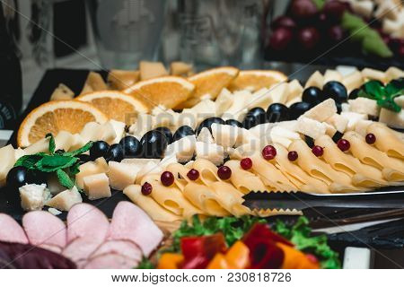 Candybar In A Restaurant. Decorated White Table Fool Of Sweet Pastry. Wedding Sweets.