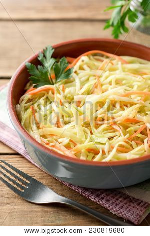 Fresh Coleslow Salad In Bowl On Rustic Wooden Table