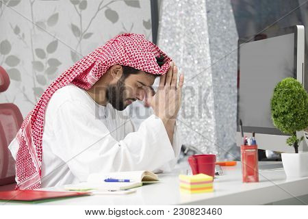 Arabian Business Man Working On Laptop In The Office.