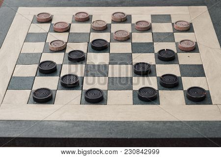 Checkers Game In Public On Sidewalk, Step Up And Take A Seat To Play The Game With A Friend Or Stran