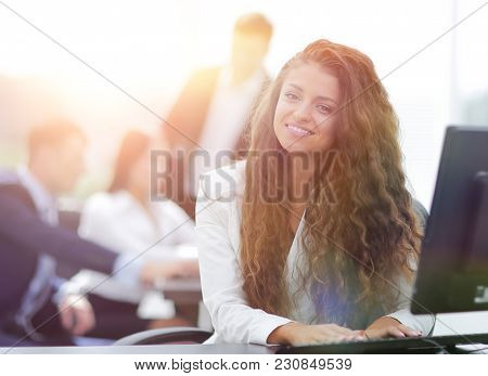 Manager woman sitting behind a Desk