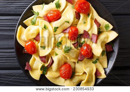Traditional Italian Pasta Casoncelli With Prosciutto Filling, With Cherry Tomatoes Close-up. Horizon
