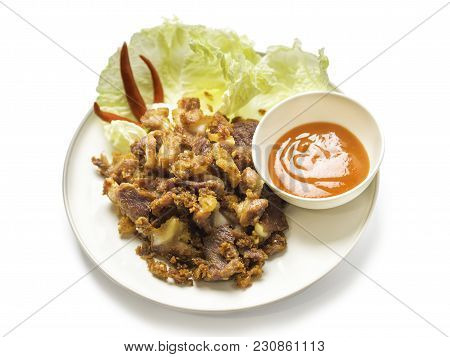 Fried Sour Pork, Fermented Pork With Sauce, Vegetable And Chili On Dish Isolated On White Background