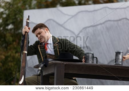 ST. PETERSBURG, RUSSIA - JULY 19, 2017: Singer Artem Melikhov in the opera The Marksman of C. M. von Weber outdoors during the festival All Together Opera. It was third of 4 performances