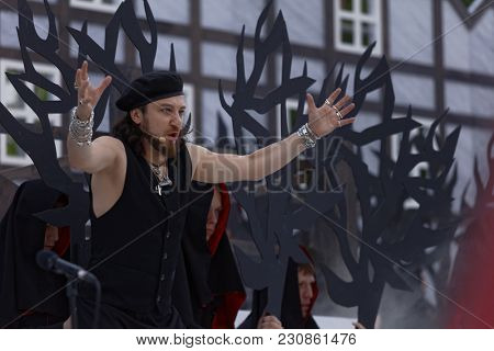 ST. PETERSBURG, RUSSIA - JULY 19, 2017: Pavel Shmulevich in the opera The Marksman of C. M. von Weber outdoors during the festival All Together Opera. It was third of 4 performances