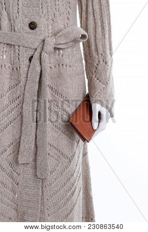 Grey Wool Coat On Mannequin. Hand Holding Brown Leater Case. White Isolated Background.