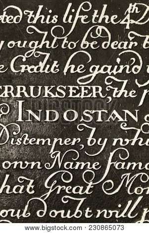 Kolkata, India - April 8, 2017: Inscription on the marble slab in the mausoleum of Job Charnock in Calcutta, West Bengal, India. Focus on Indostan word in the middle