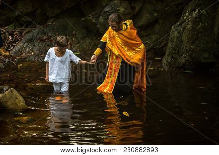 KOH CHANG, THAILAND - MAR 9, 2018: During Christian sacrament of spiritual birth - Baptism. There are currently 10 Orthodox parishes in Thailand, Orthodoxy is practiced by 0.002% of population.