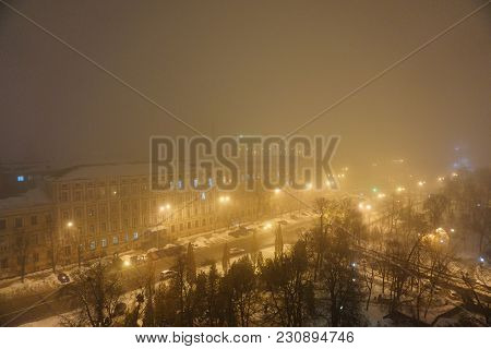 Foggy Evening In Center City. Yellow Street Night Lights. View From Top Roof To Mikhaylovskaya Squar