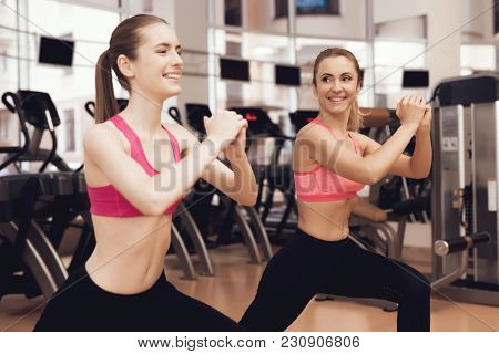 Woman And Girl In Sportswear Doing Aerobical Exercises At The Gym. They Look Happy, Fashionable And 