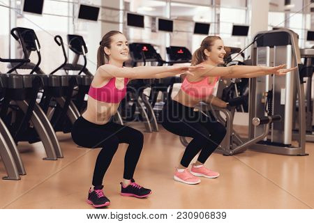 Woman And Girl In Sportswear Doing Aerobical Exercises At The Gym. They Look Happy, Fashionable And 