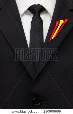 The Detail Of Wedding Suit With Golf Design.golf Tees In The Color Of Spanish Flag On The Flap Of Bl