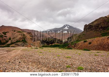 Icelandic Landscape With Red Hills In Lonsoraefi In Cloudy Weather
