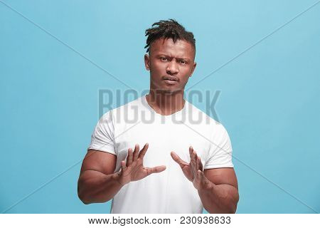 Young Afro-american Man With Disgusted Expression Repulsing Something, Isolated On The Blue