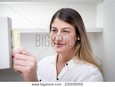 Cashier Swiping Credit Card At Register
