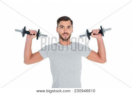 Portrait Of Sportsman Exercising With Dumbbells Isolated On White