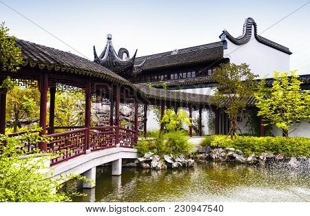 A Water Fountain And Covered Corridor At The Classical Chinese Li Yuan Garden In Zhaojialou In Shang