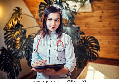 Emale Doctor On Duty Welcoming Patient At The Hospital, Friendly Professional, Healthcare