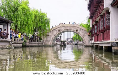 July 5, 2015.  Shanghai, China.  Chinese Tourists On The Many Bridges And Boats On The Water Canals 