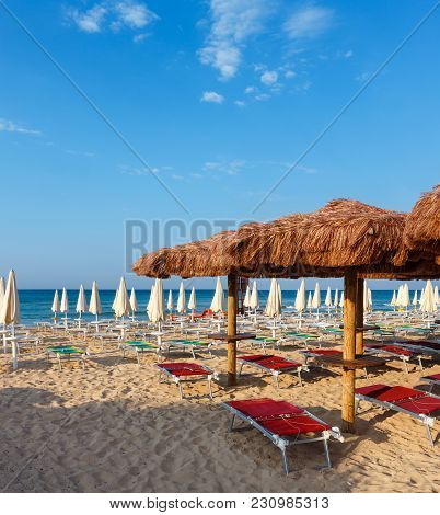 Morning Paradise White Sandy Beach Maldives Of Salento With Sunshades And Sunbeds (pescoluse, Salent