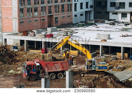Machinery And Bulldozer With Ground And Beam At Building Contstruction Site On Background Of Dirty G