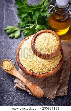Couscous Grain In Wooden Bowl. Top View