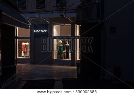 Bourgoin-jallieu, France - July 16, 2019: Naf Naf Logo In Front Of Their Shop In A Deserted Pedestri